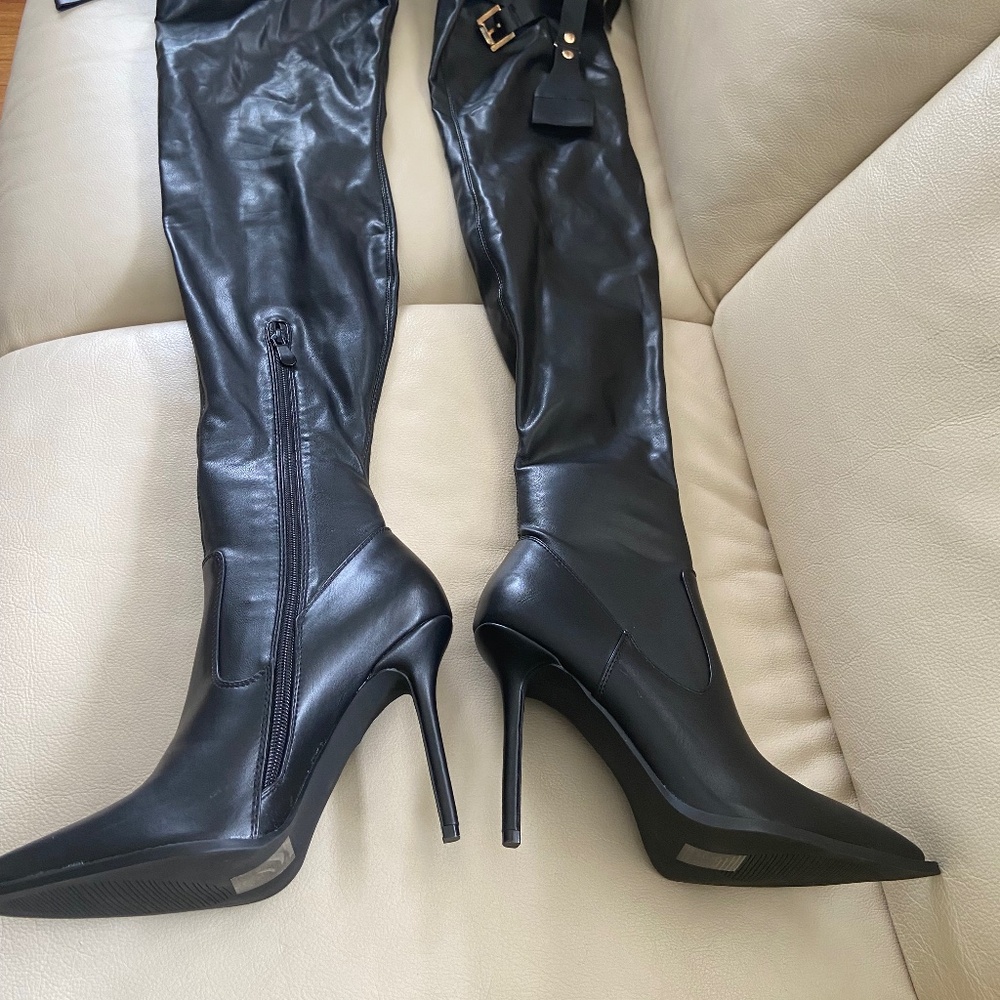 Black thigh high heeled boots